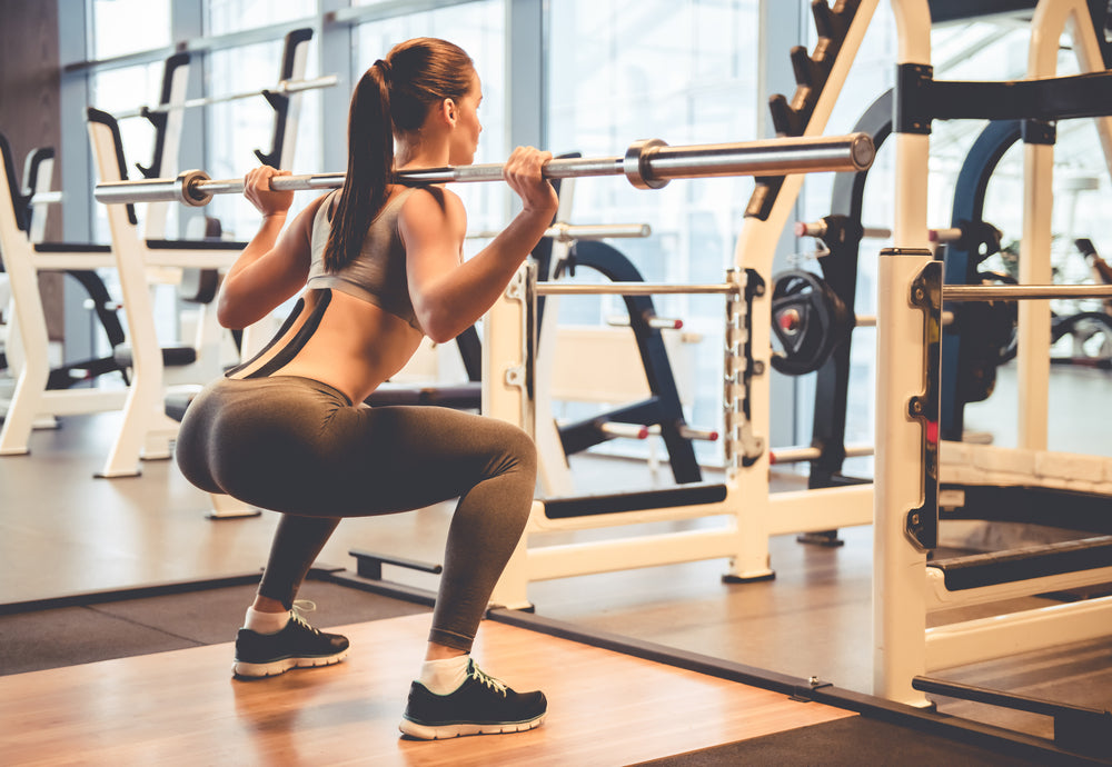 fitness woman pumping up butt booty legs muscles Stock Photo