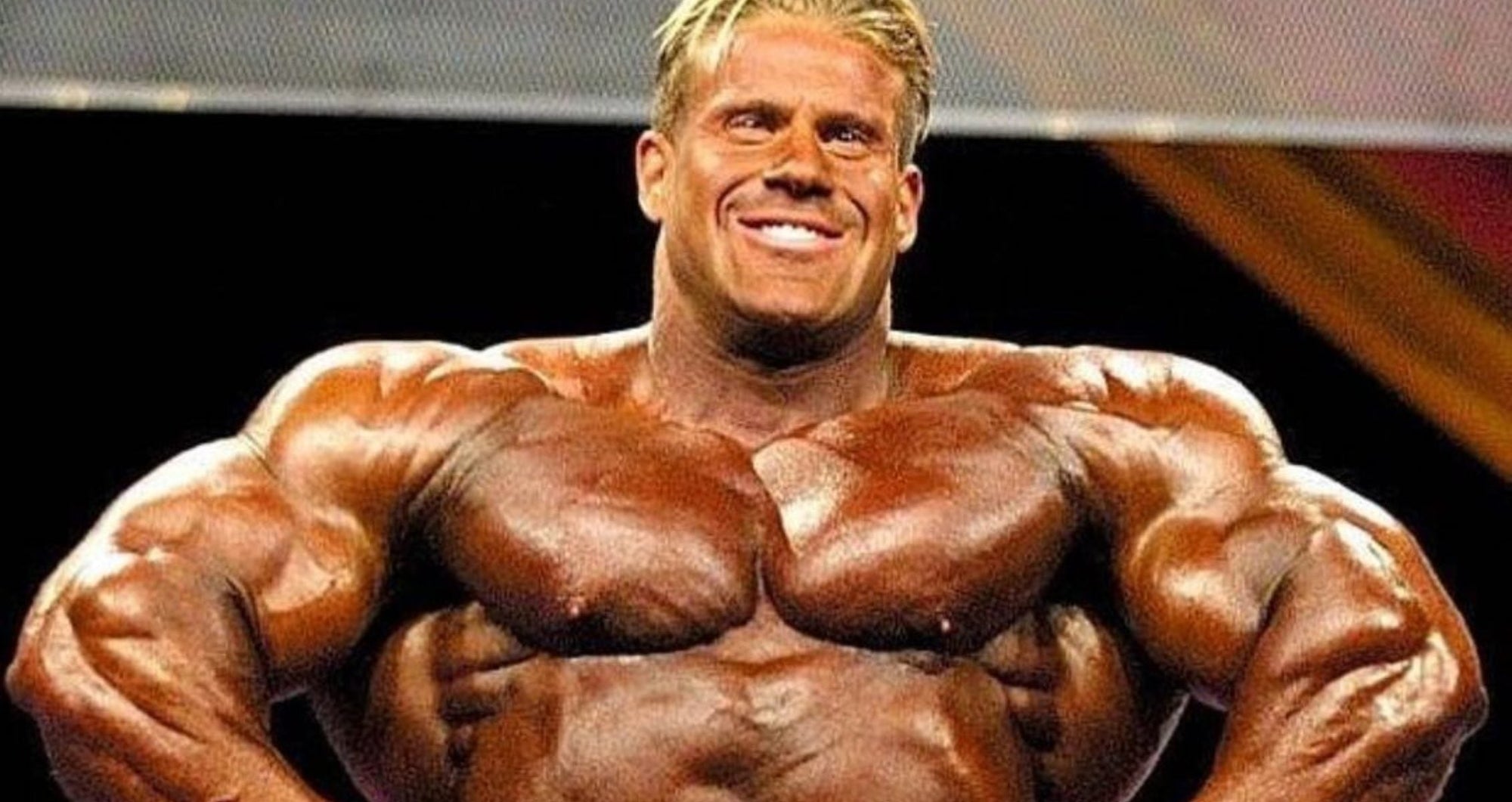 Muscular man showing back muscles