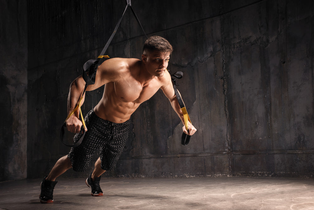  strong man does crossfit push ups with Trx fitness straps