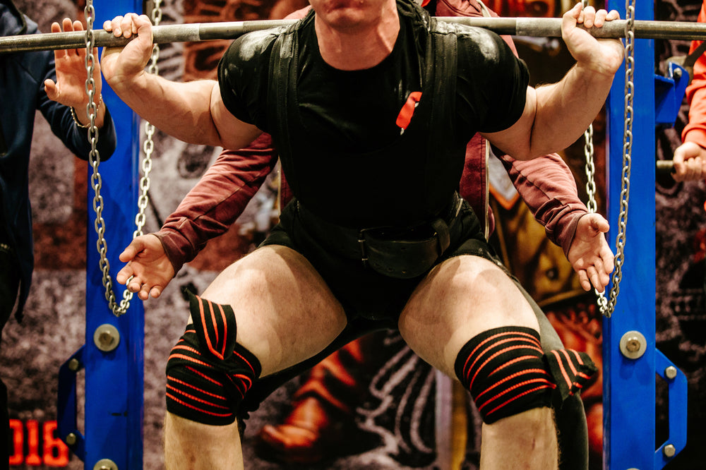 powerlifter in knee wraps exercise squat powerlifting