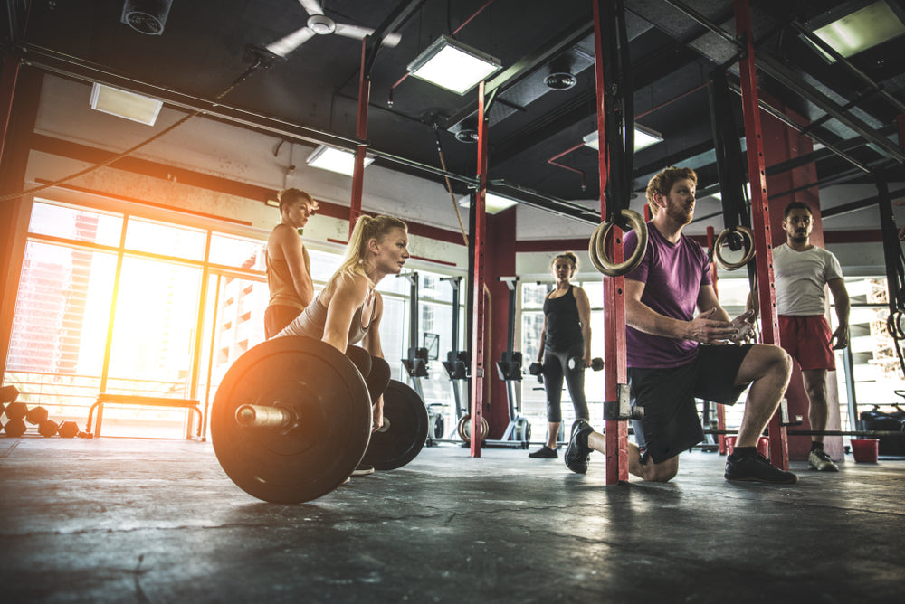 Muscular athletes training in a fitness studio Functional training workout in a gym
