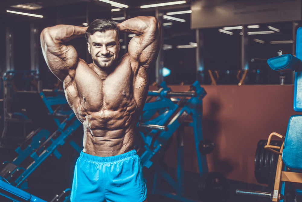 lean and muscular bodybuilder in a gym