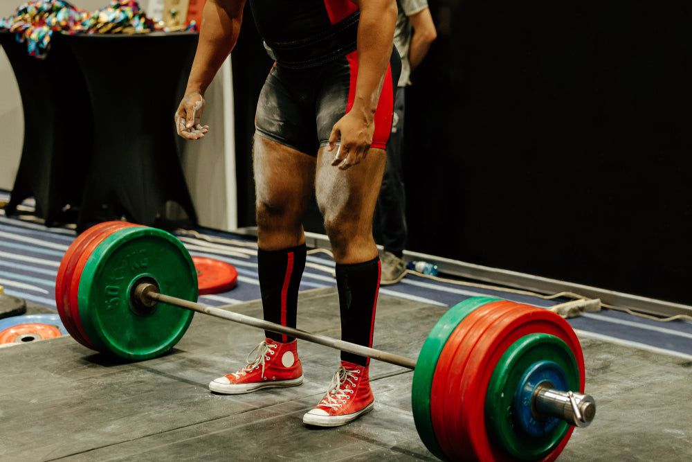 performing deadlift man powerlifter competition powerlifting
