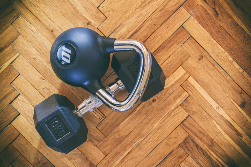 Kettlebell and Dumbbell on the Gym Floor