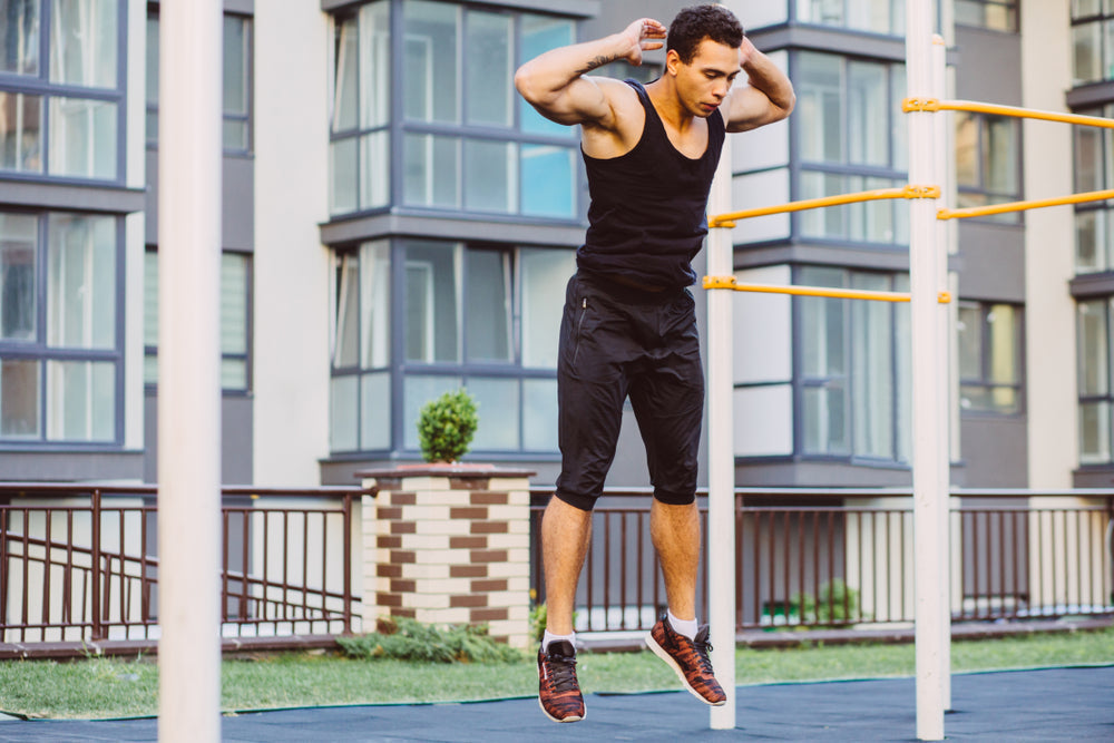 man doing burpees outdoors