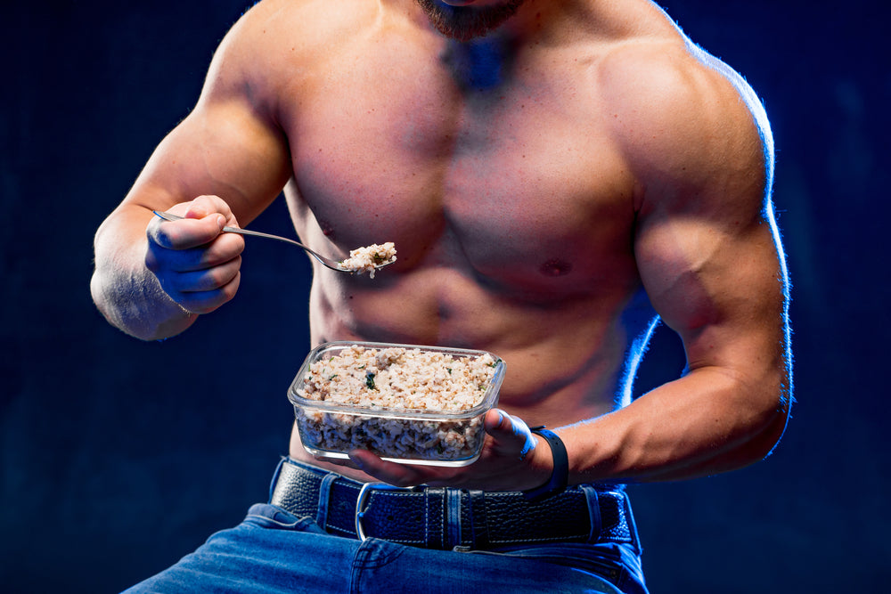 Muscular bodybuilder eating healthy cereal.