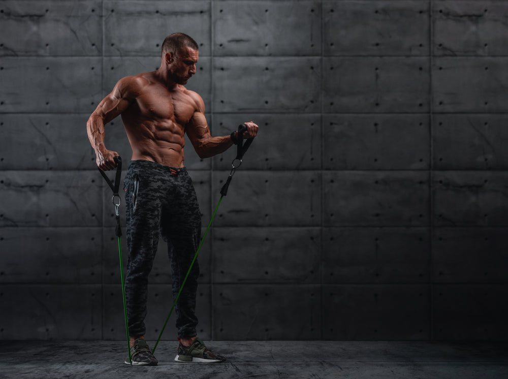 Muscular Athletic Men Exercise With Resistance Band