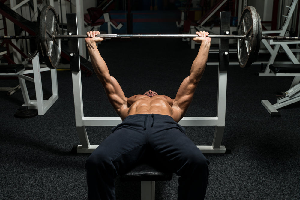 man bench pressing at the gym