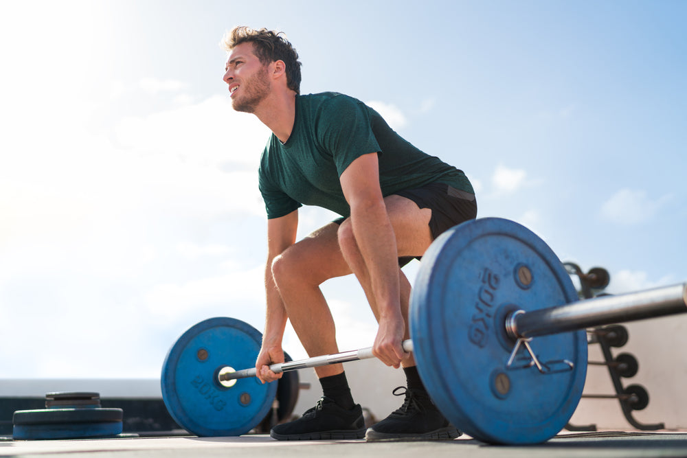 Huge man is preparing to perform an exercise called deadlift