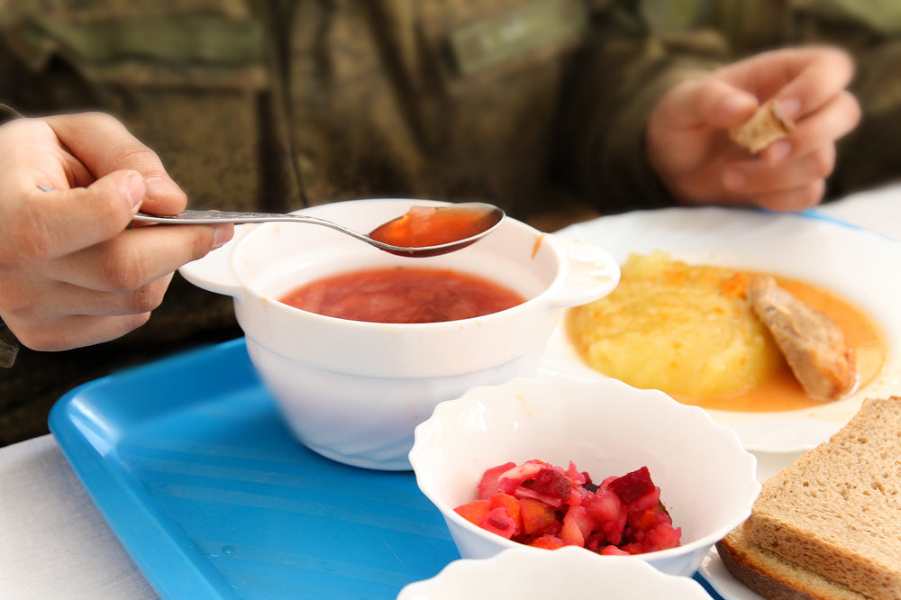 Soldier having lunch in the dining room