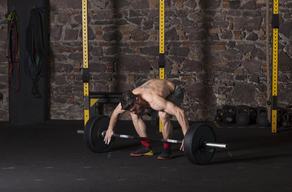 Athlete executing olympic lifts